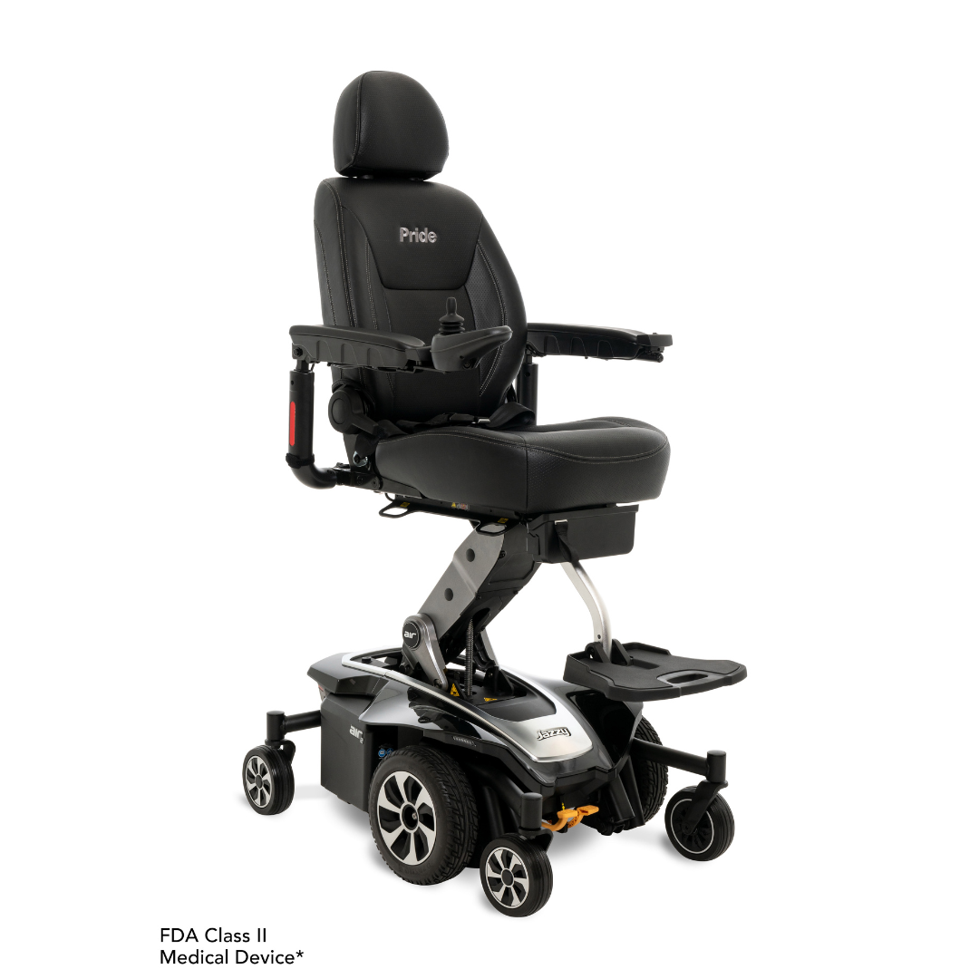 The Pride Mobility Jazzy Air® 2 Powerchair with Seat Elevation is a black electric chair featuring adjustable armrests, padded seat and backrest, footrest, joystick control, sturdy base with Mid-Wheel 6® Tech, and a Pride logo on the headrest.